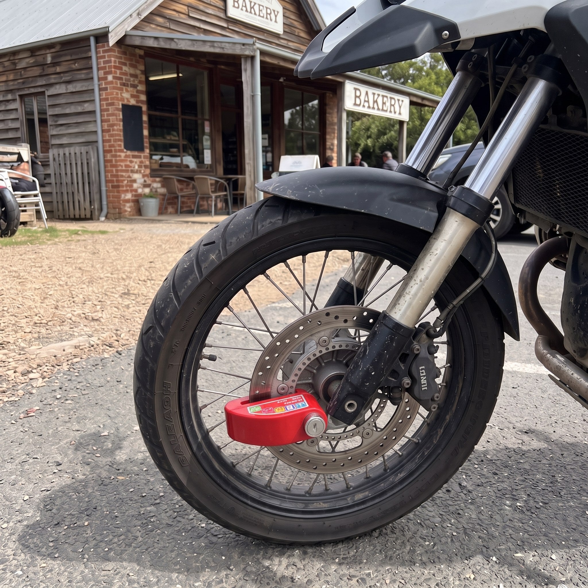 RideLatch in an everyday motorcycle parking scene 3
