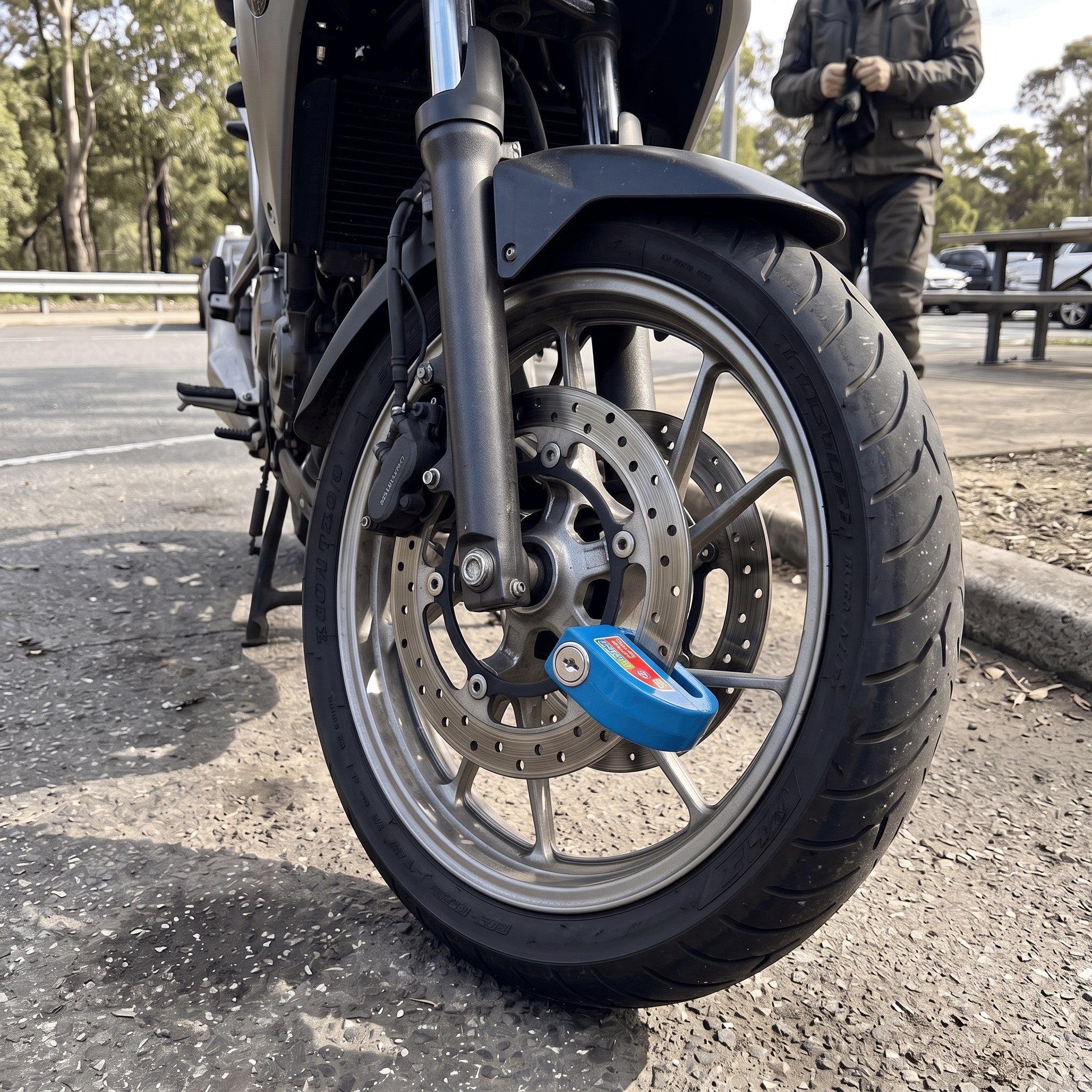 RideLatch in an everyday motorcycle parking scene 10